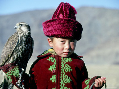 Young Boy Holding a Falcon, Golden Eagle Festival, Mongolia